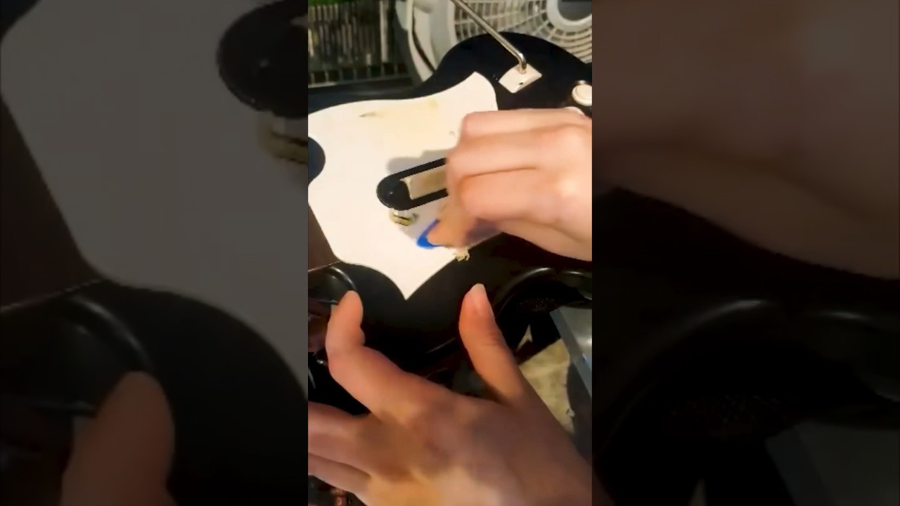 Speedrunning the stickers off of a guitar hero controller! 🧽 #retrogaming #videogames #cleaning
